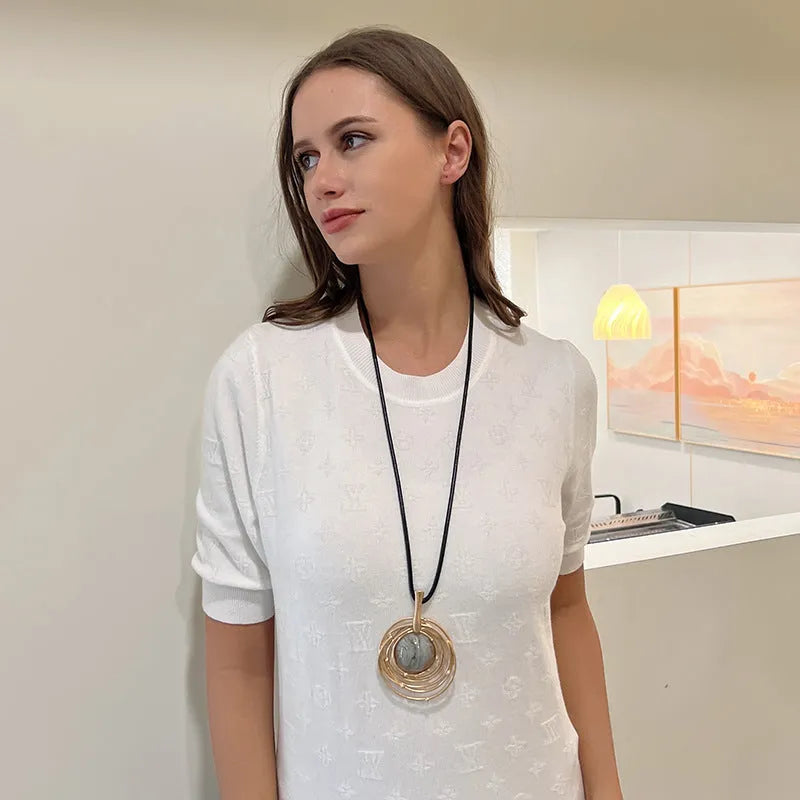 Vintage women's sweater chain necklace with large round geometric pendant in gold finish