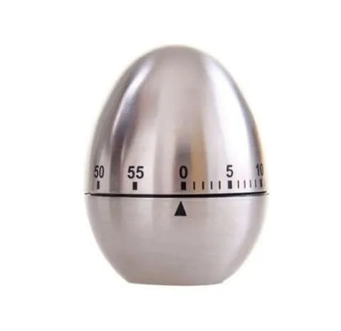 Stainless steel egg-shaped mechanical kitchen timer on countertop