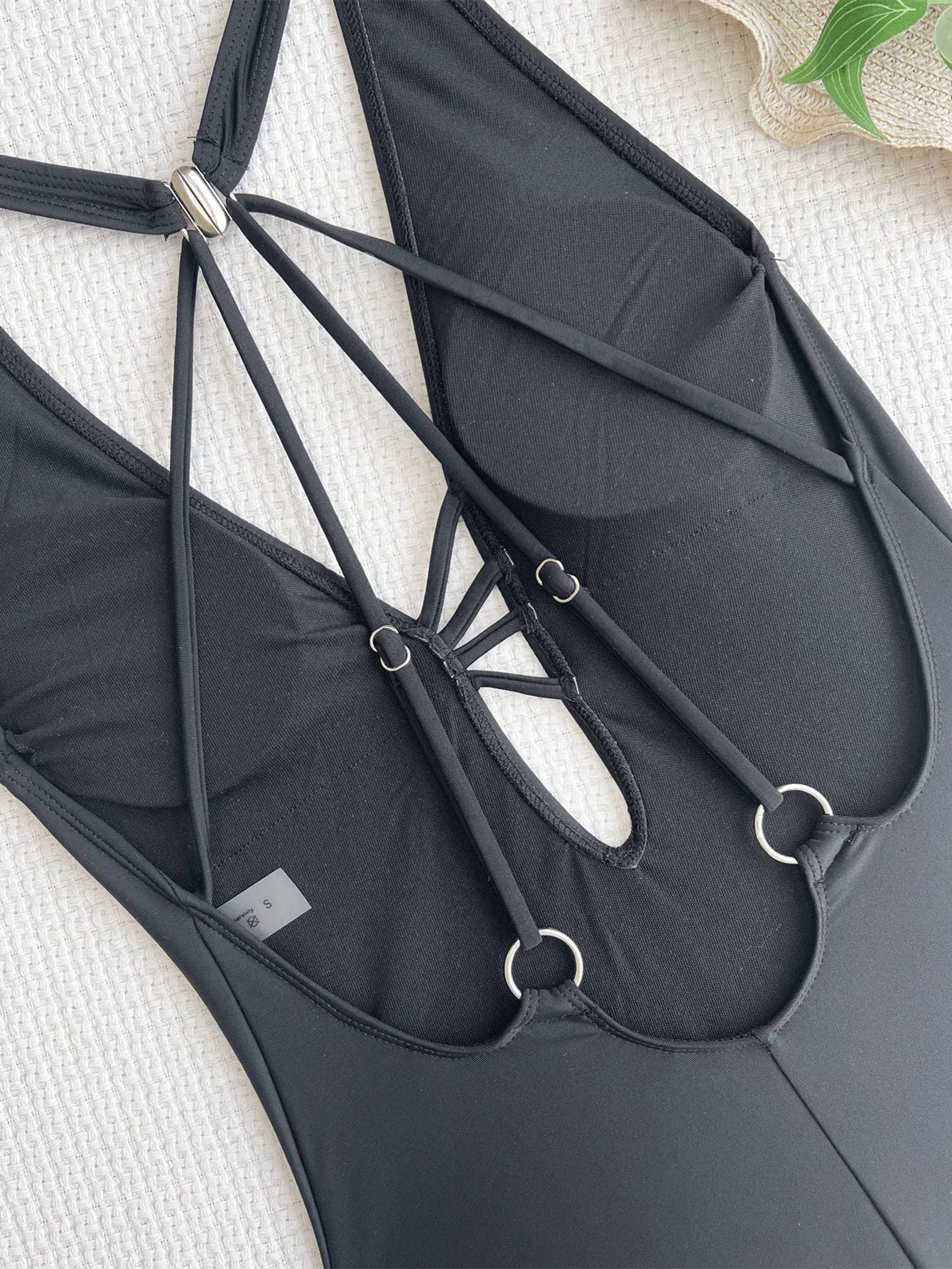 Black solid colour one-piece swimsuit bikini for women made from nylon fabric