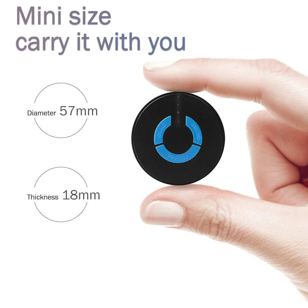 Black mini electric shoulder and neck massager with massage patch next to its 15cm long packaging.