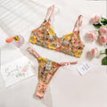 Floral patterned mesh bra with steel ring and matching T-back briefs in a choice of colours.