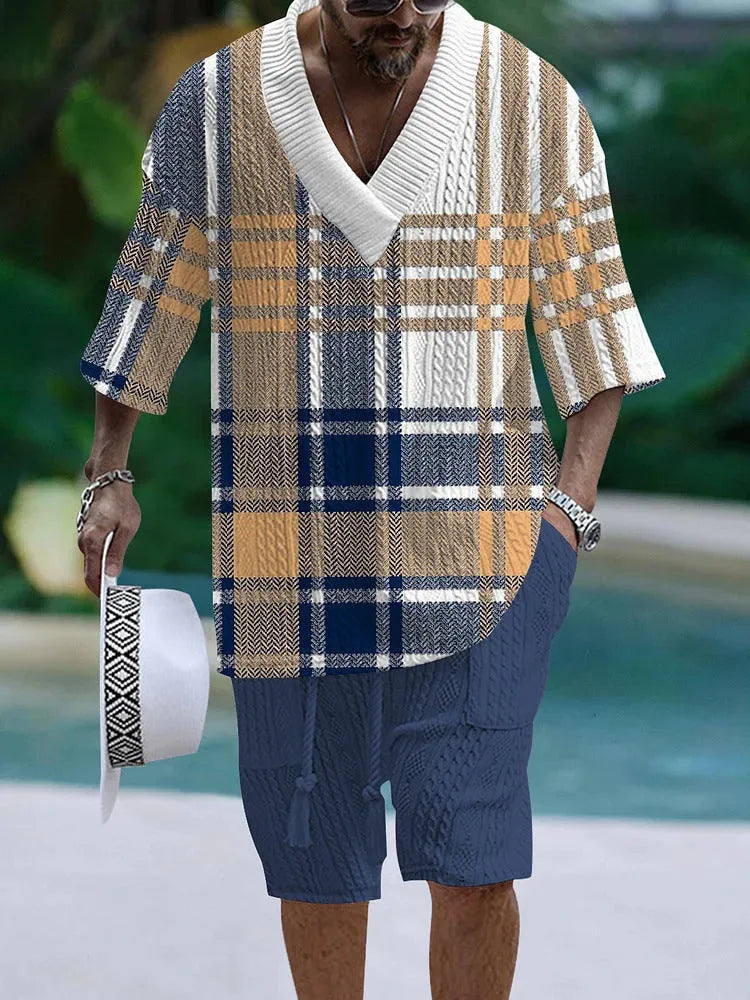 A man's loose-fitting casual short sleeve suit in a solid colour, featuring a short-sleeve top and matching shorts.