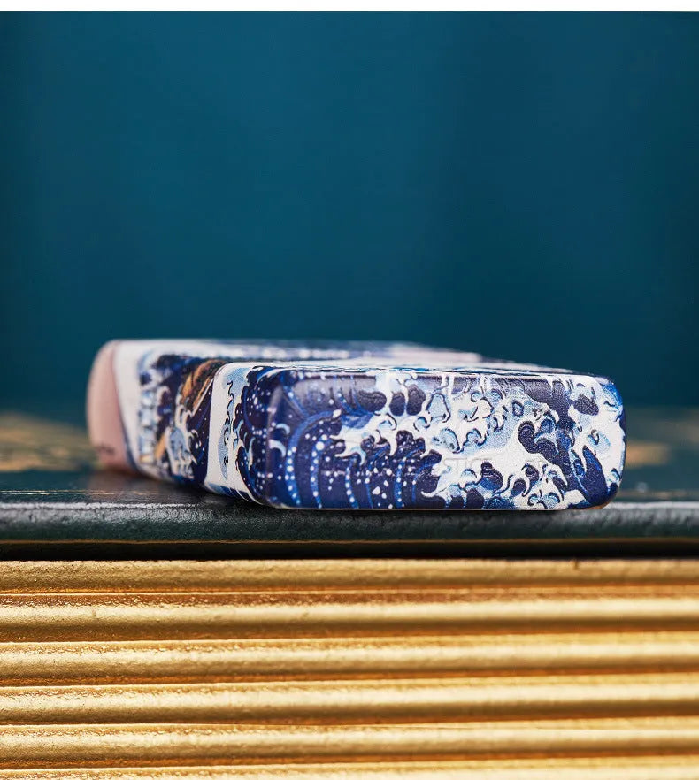 Coloured lacquer windproof lighter with Kanagawa surf design on copper housing, 58x39x13mm