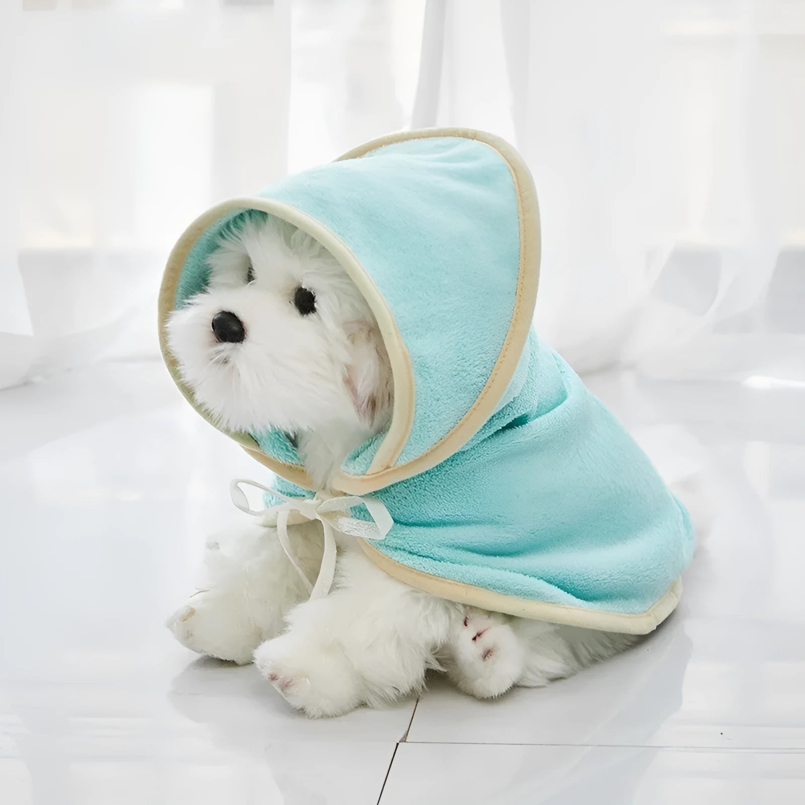 Microfiber pet quick-drying bathrobe in beige, folded on surface