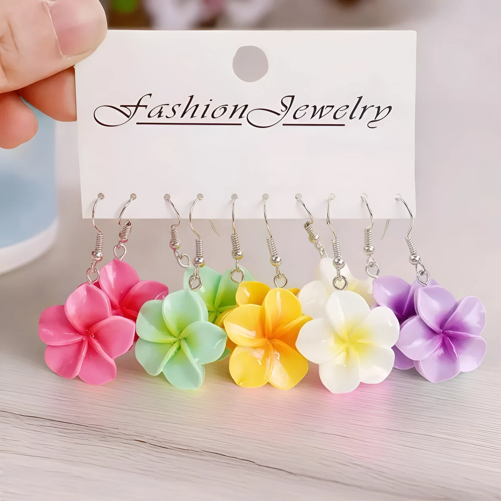 Handmade resin Plumeria Rubra earrings in seven colours including pink, blue, purple, white, green, yellow, and rose red