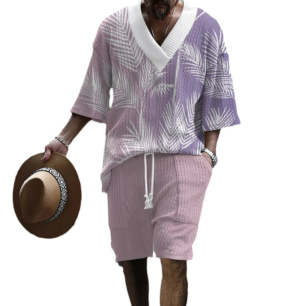Man wearing a printed drop-shoulder knitted top and matching shorts from a leisure suit set.