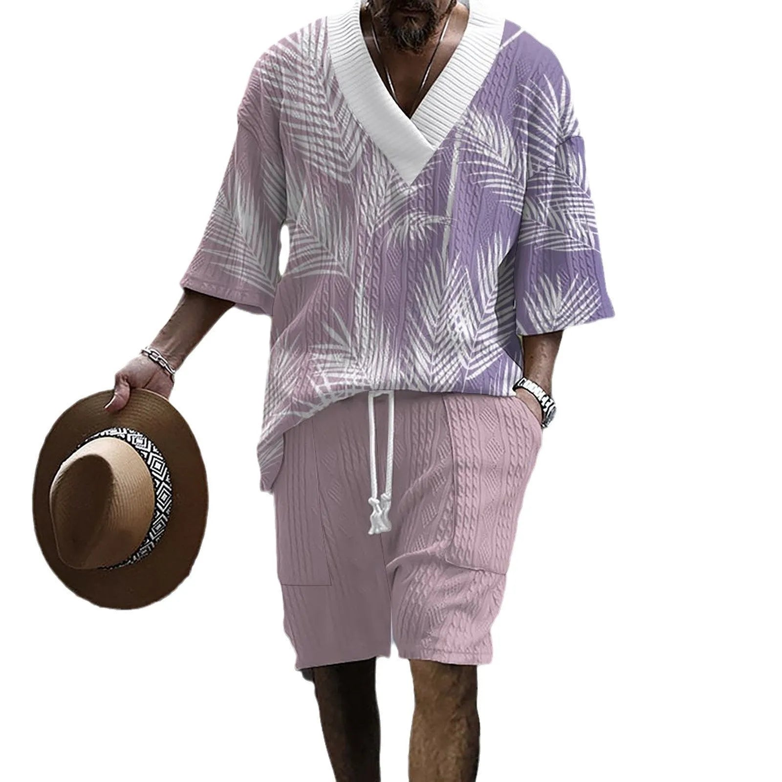Man wearing a printed drop-shoulder knitted top and matching shorts from a leisure suit set.