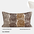 Cream and coffee coloured abstract coil pattern square and waist pillow covers on a sofa.