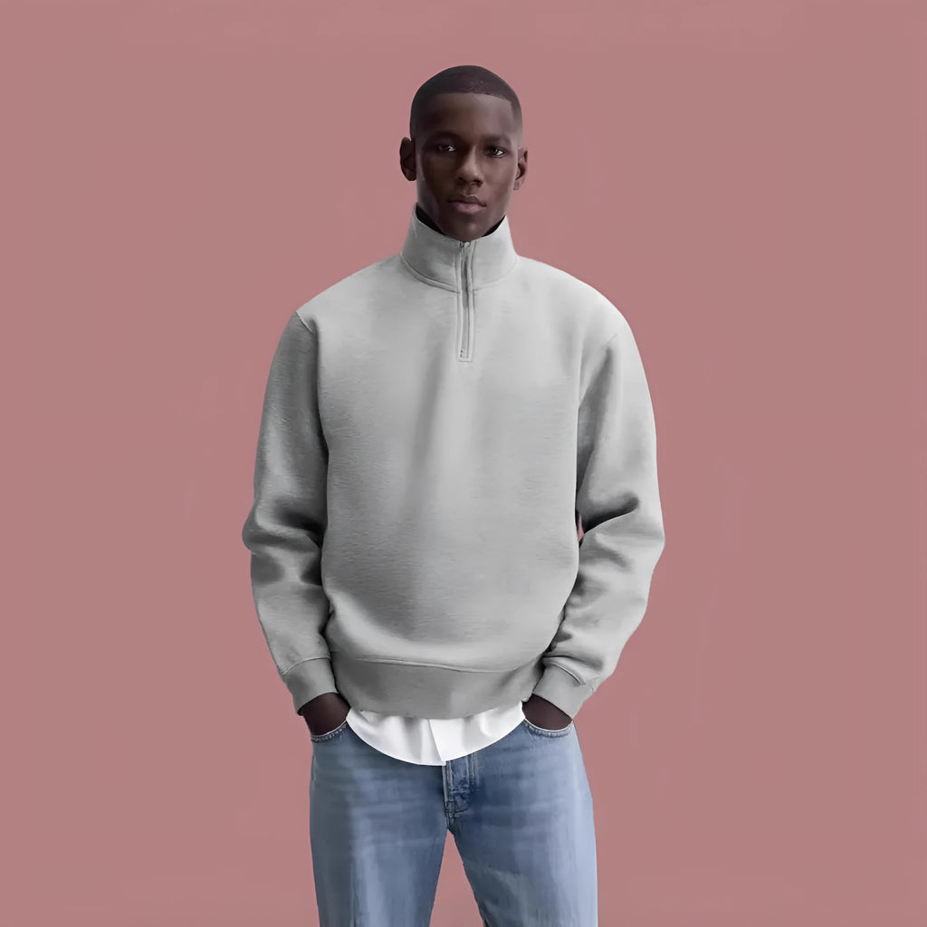 Grey half zip stand collar cotton sweater for men and women on a hanger.