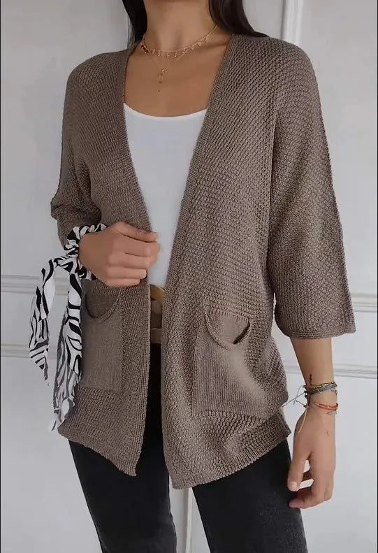 Women's waffle texture cardigan coat with nine-quarter sleeves in army green colour showing side pockets