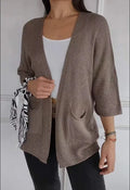 Women's waffle texture cardigan coat with nine-quarter sleeves in army green colour showing side pockets