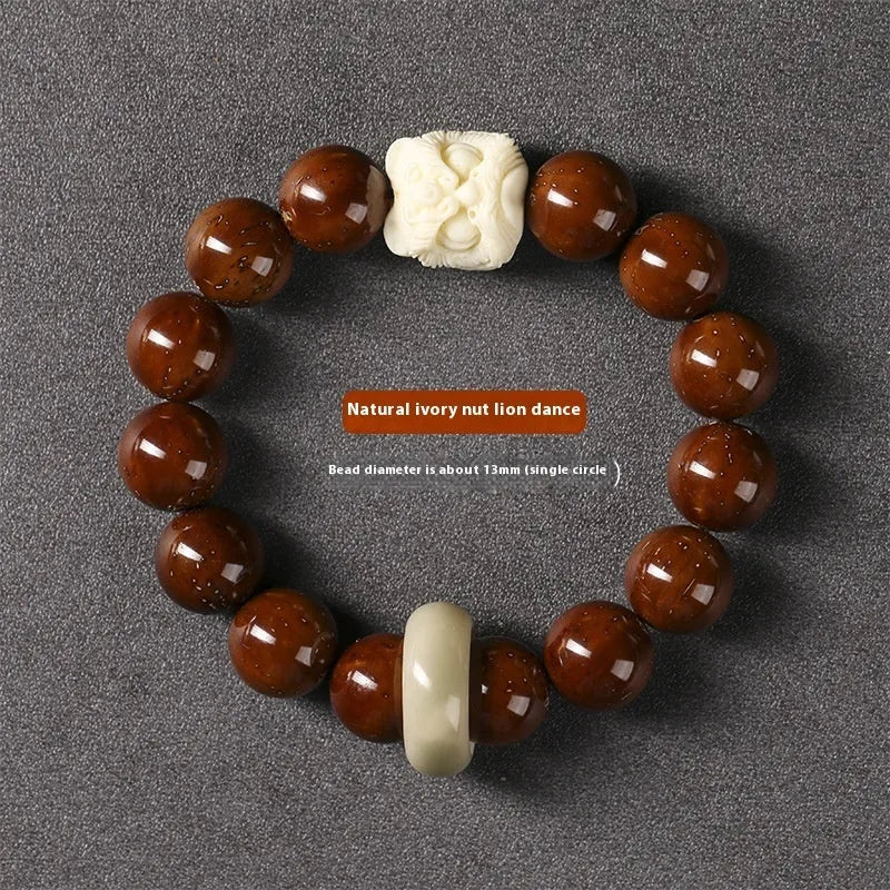 Hand-woven bracelet with 13mm round beads and a carved lion bead centrepiece in ivory nut style.