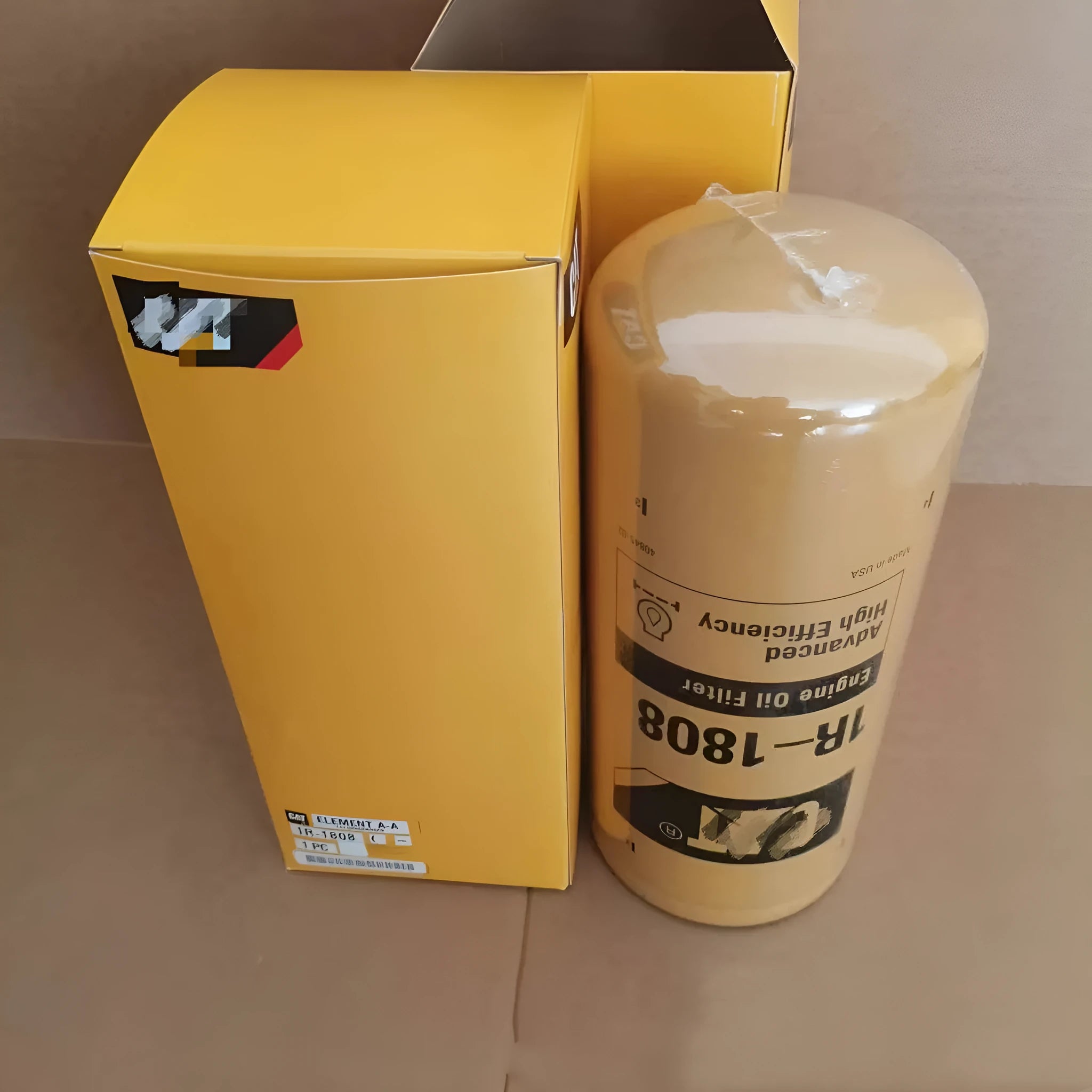 Carter 1R-1808 metal oil filter element for excavator hydraulic systems.