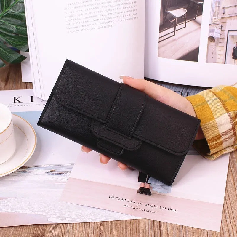 Women's long tri-fold clutch wallet in solid colour with sewing thread detail, PU leather exterior, large capacity