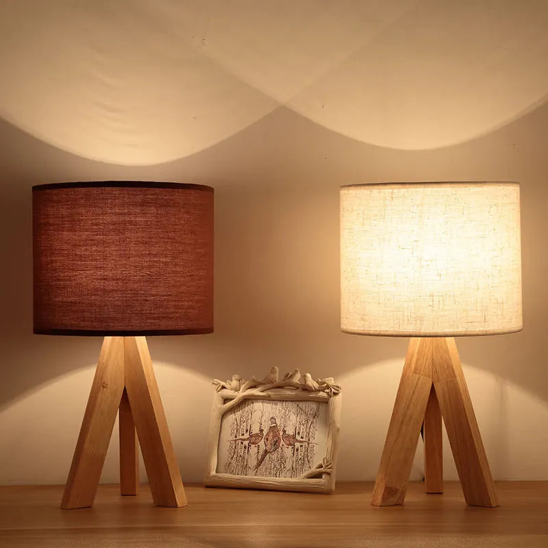 Japanese style solid wood table lamp with fabric lampshade in brown trumpet colour on bedside table
