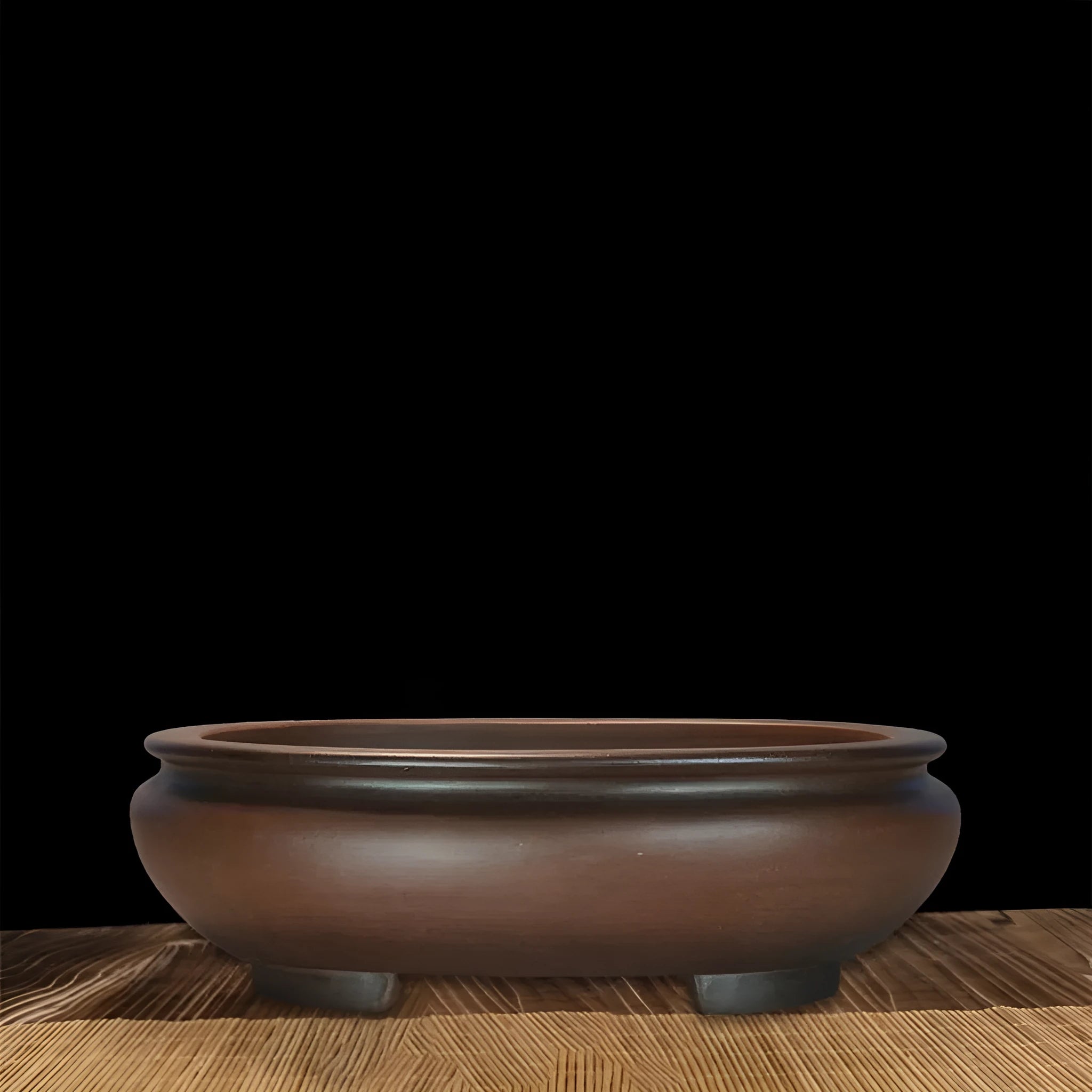 Handmade purple clay classical style desktop flowerpot on a wooden surface