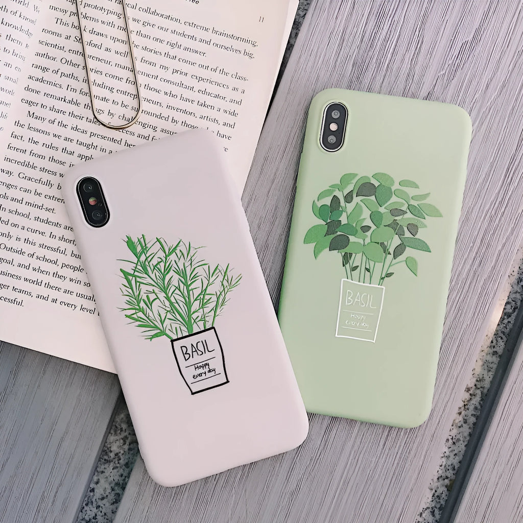 White silicone iPhone case with a detailed painted plant design on the back, showing the smooth texture and enclosed edges.