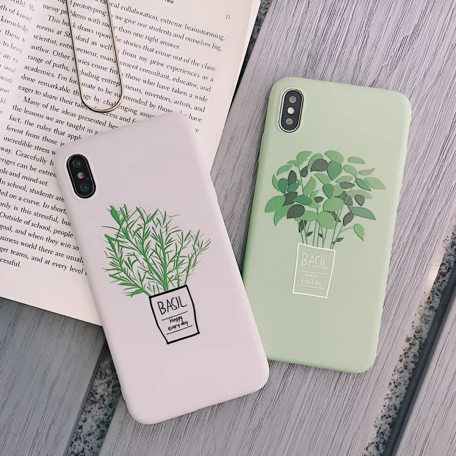 White silicone iPhone case with a detailed painted plant design on the back, showing the smooth texture and enclosed edges.