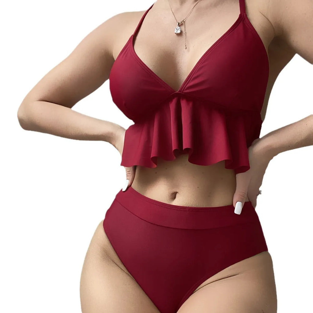 Women's solid colour high-waisted bikini with adjustable ties on the top.