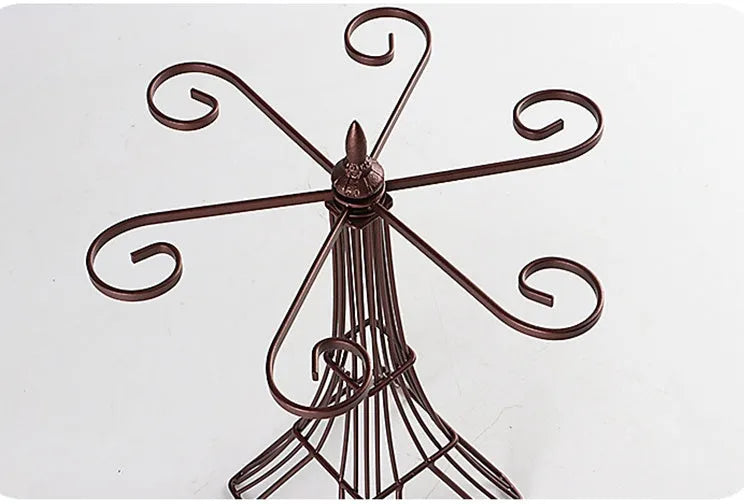 Bronze iron wine glass holder measuring 26x15x33cm on a bar countertop with two goblets hanging