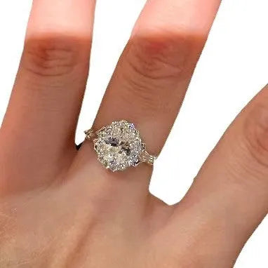 Silver women's ring with large geometric diamond centrepiece and adjustable opening.