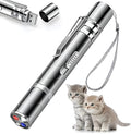 Silver aluminium cat laser pointer toy showing light patterns on a wall next to a cat.
