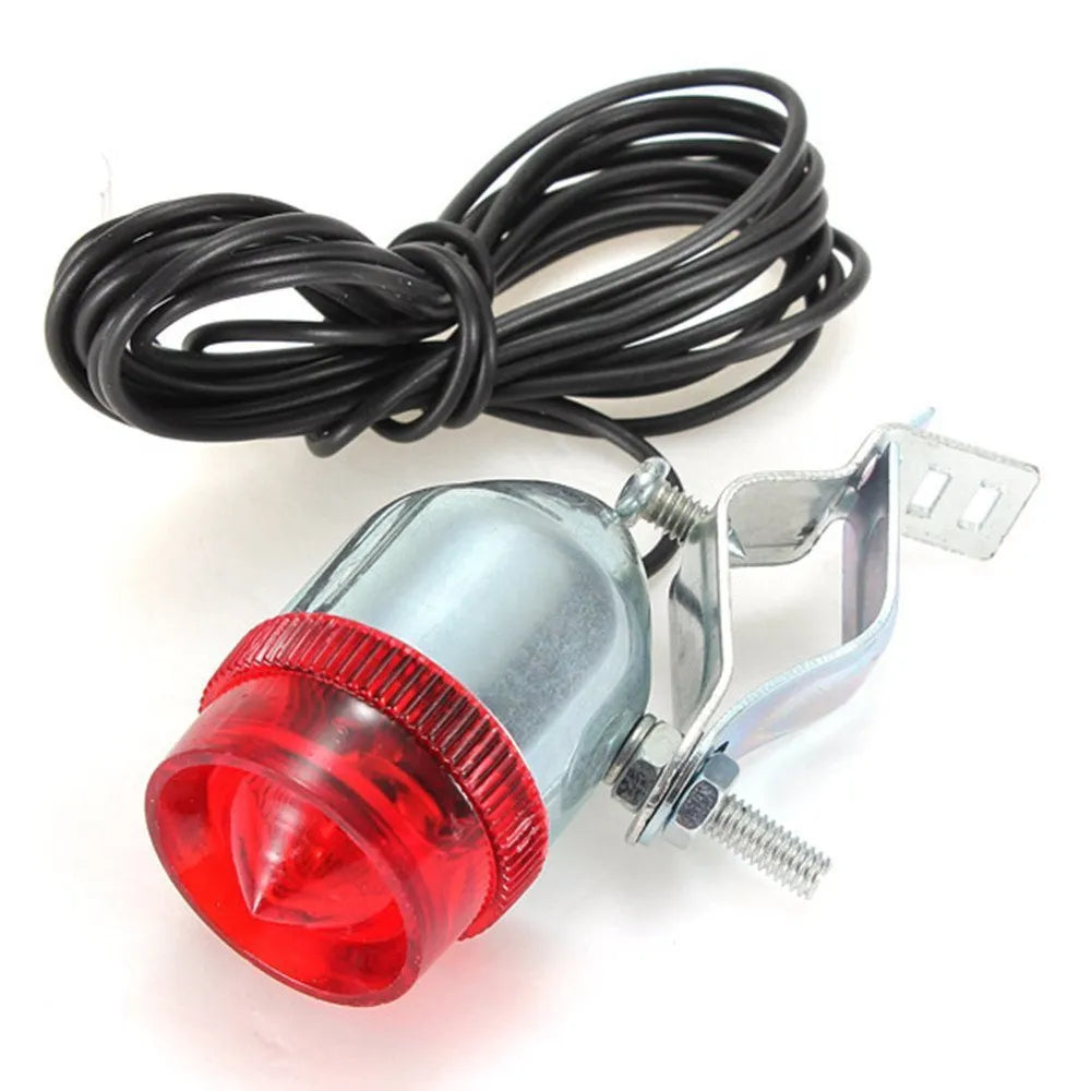Silver bicycle dynamo-powered generator light kit for mounting on frame, showing wiring connectors.