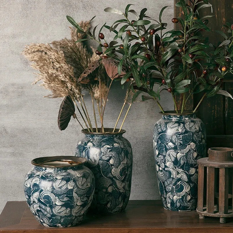 New Chinese retro artistic ceramic vase with dried flowers on a tabletop in a home living room setting
