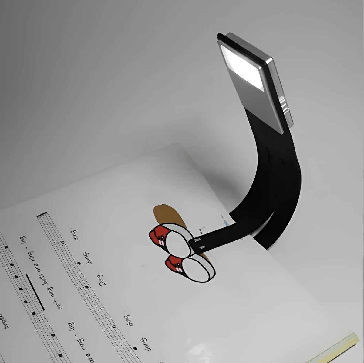Black folding LED reading lamp for Kindle, 205x40x9mm, USB rechargeable with adjustable brightness