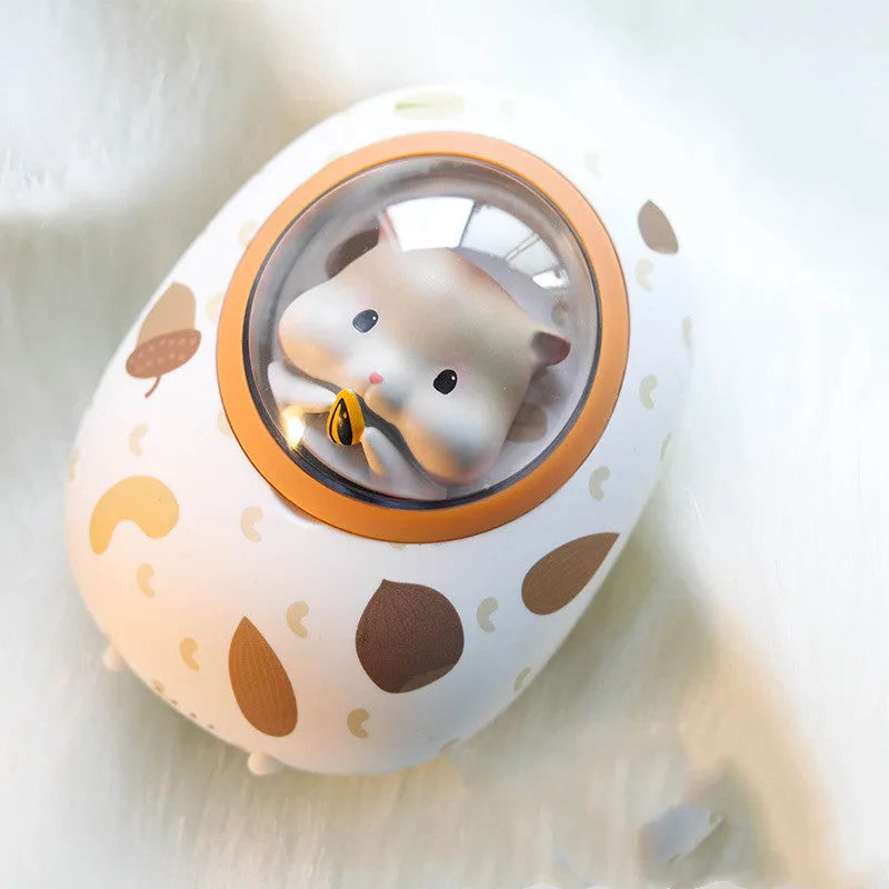 White Hamster hand warmer and power bank unit showing compact dual-function design.