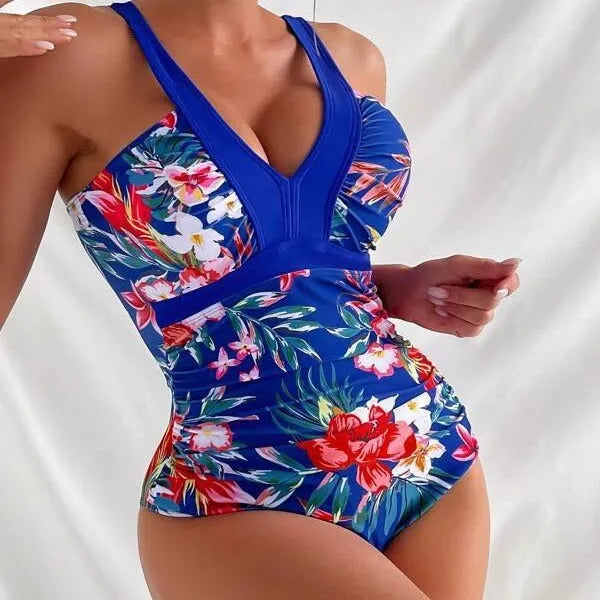 Women's floral pattern one-piece swimsuit with a backless design on a mannequin