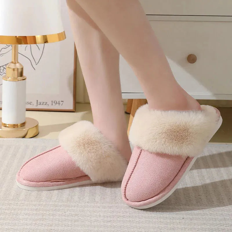 Women's brown plush indoor slippers with a round toe, flat heel, and a textured PVC sole.