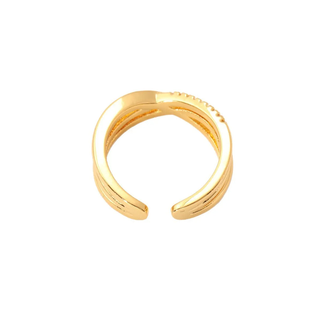 Women's gold open ring with geometric line pattern on copper base