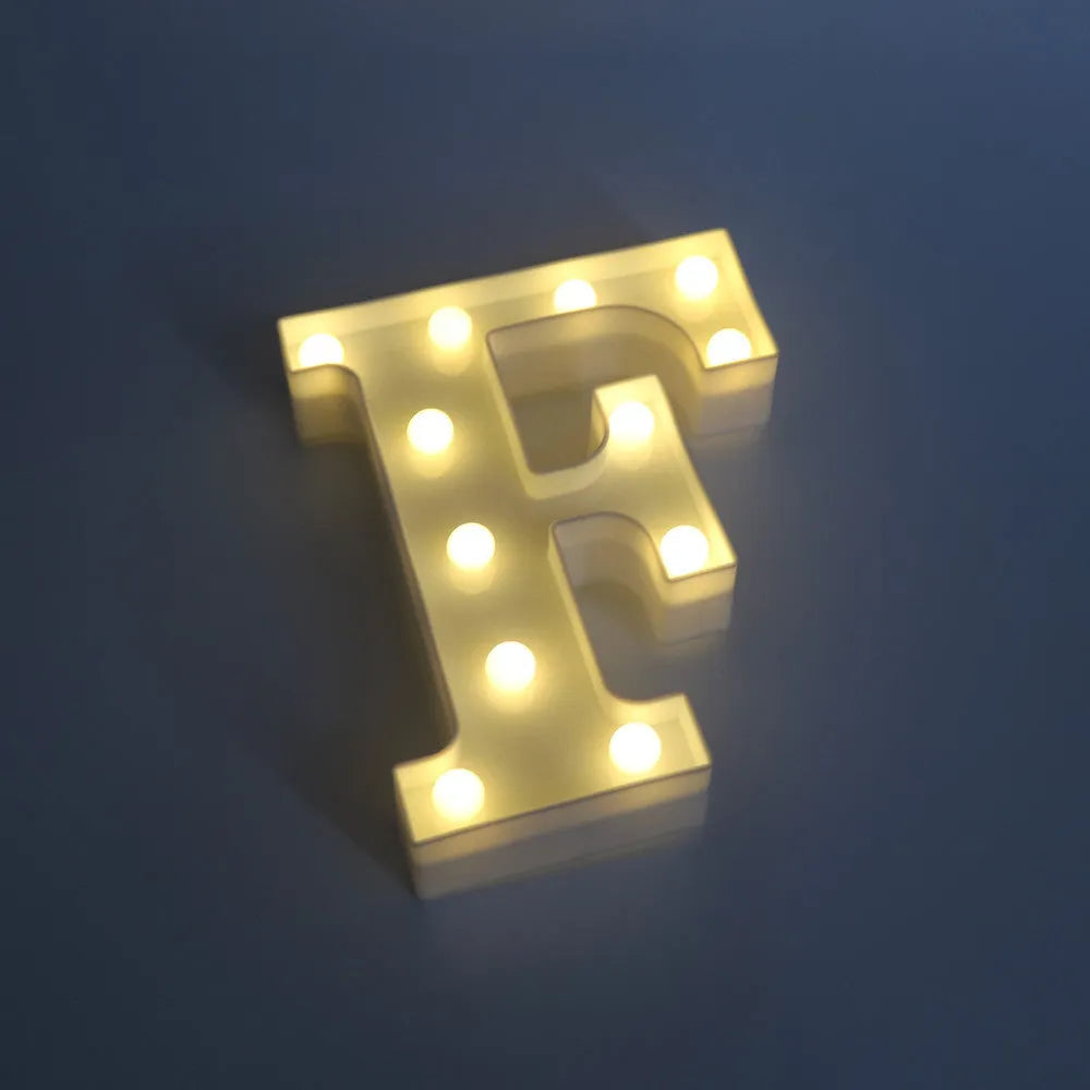 White plastic LED marquee letter sign with warm white glow, 22cm tall