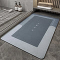 Blended material bathroom floor mat in oval and rectangle shapes on a tiled floor.