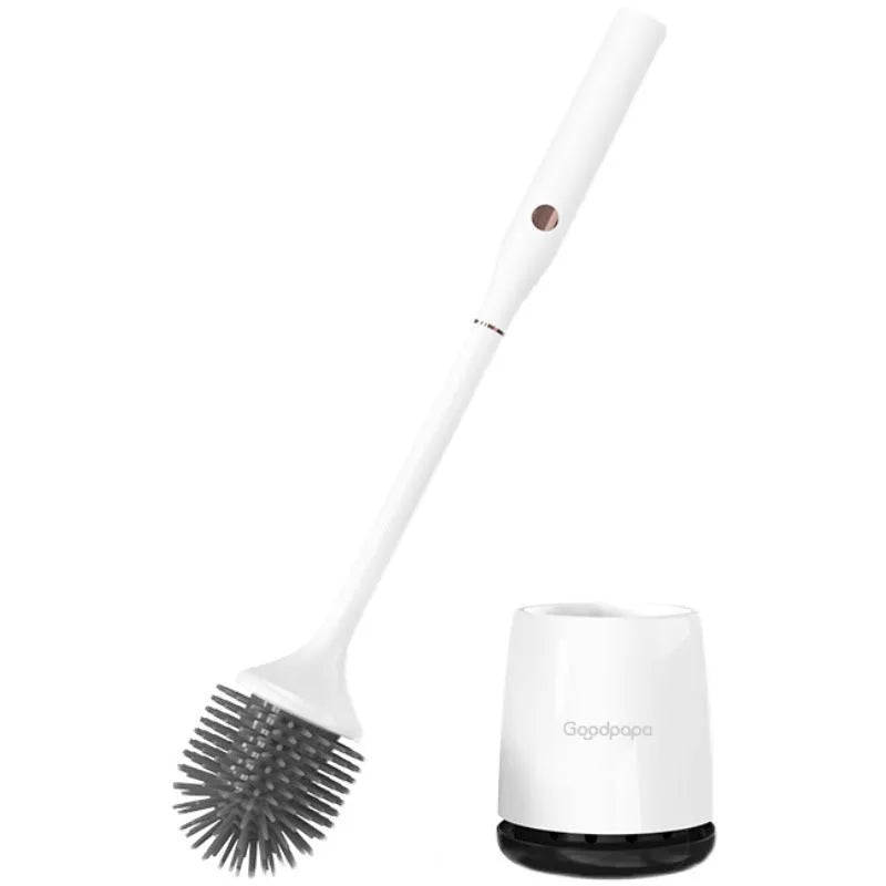 White wireless electric toilet brush with base and USB cable on a bathroom floor