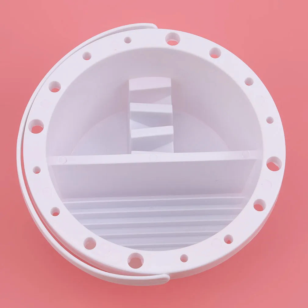 White plastic art brush holder with cake mould design measuring 16.5cm diameter