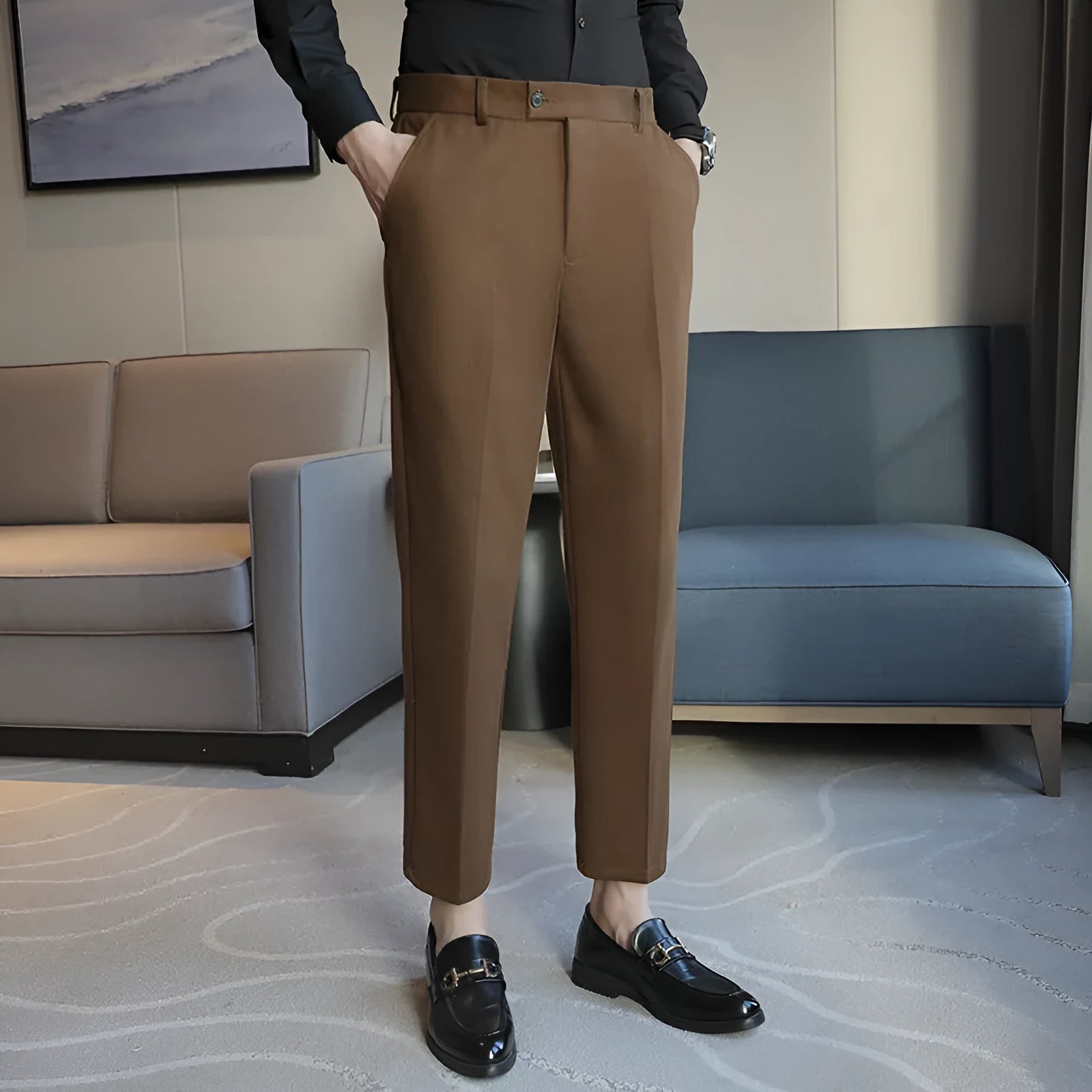 Men's straight cut brown corduroy trousers with elastic waistband shown front and side view