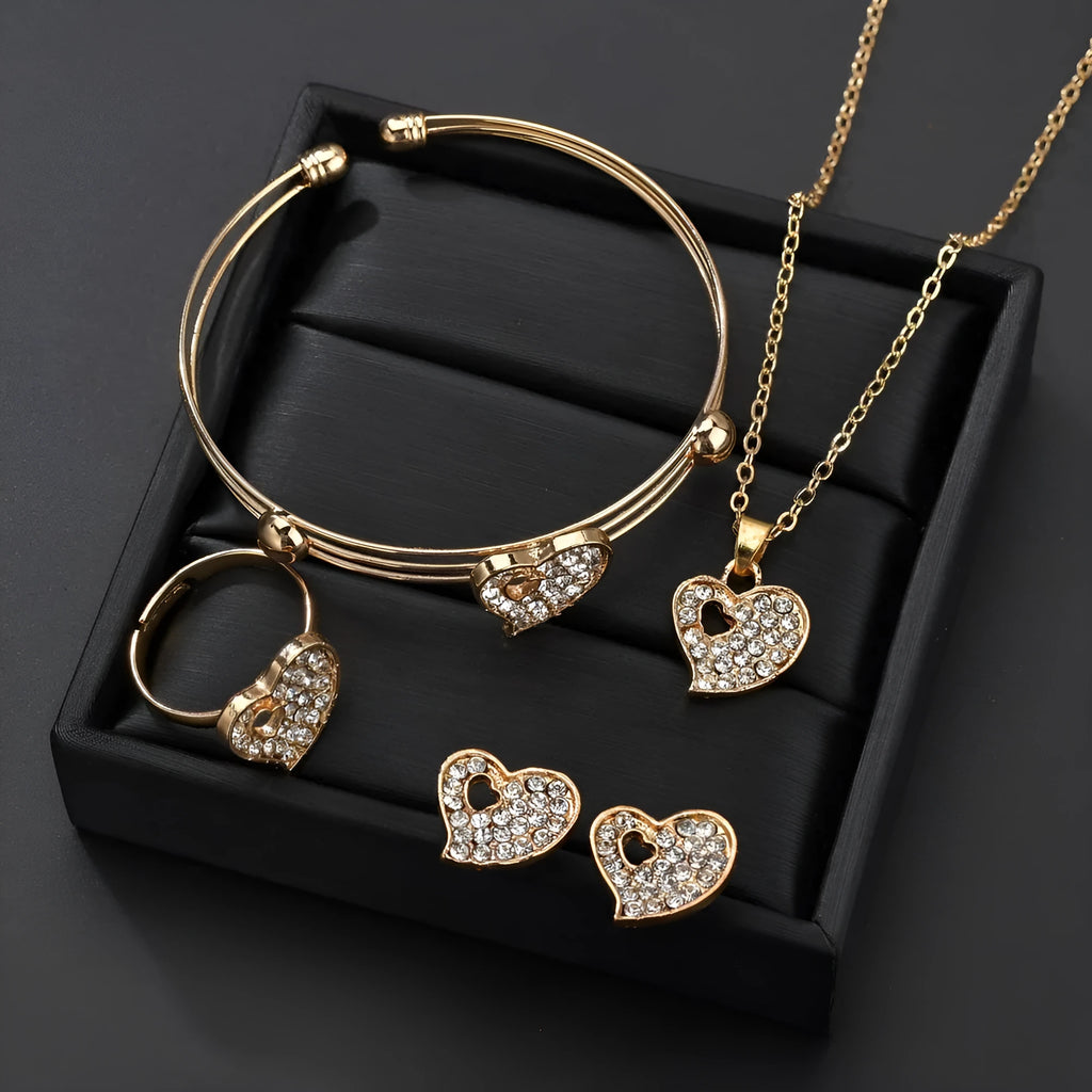 Women's gold tone alloy jewelry set with matching earrings, pendant and bracelet featuring love patterns