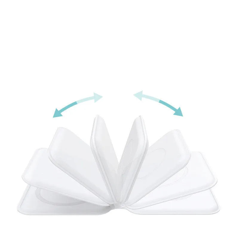 White foldable magnetic wireless charging dock with a phone attached and earbud case on the base.