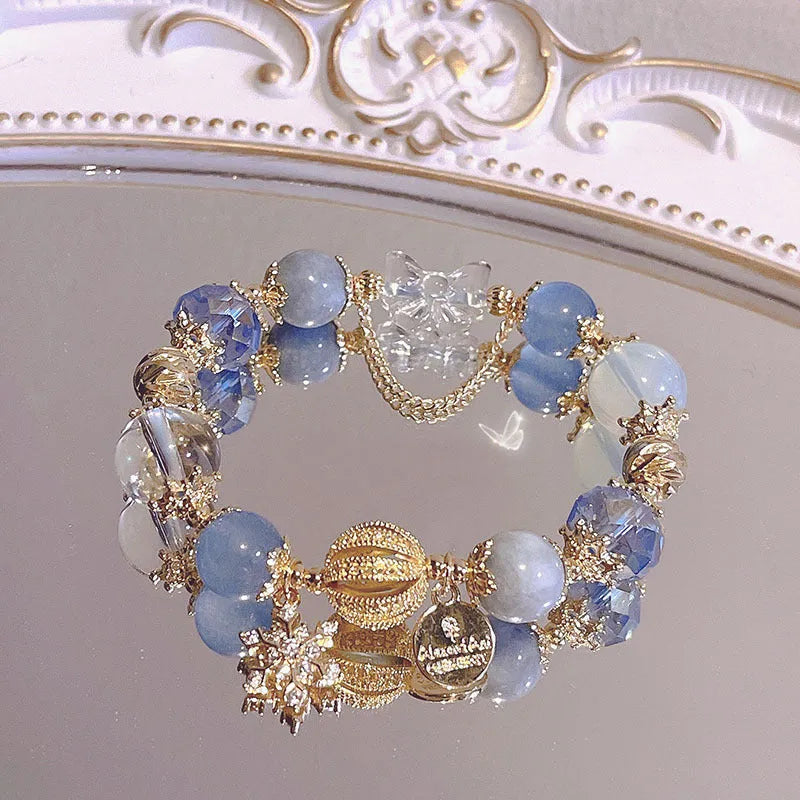 Women's galaxy colour bracelet with snowflake pendant and bow design on heart-shaped alloy base