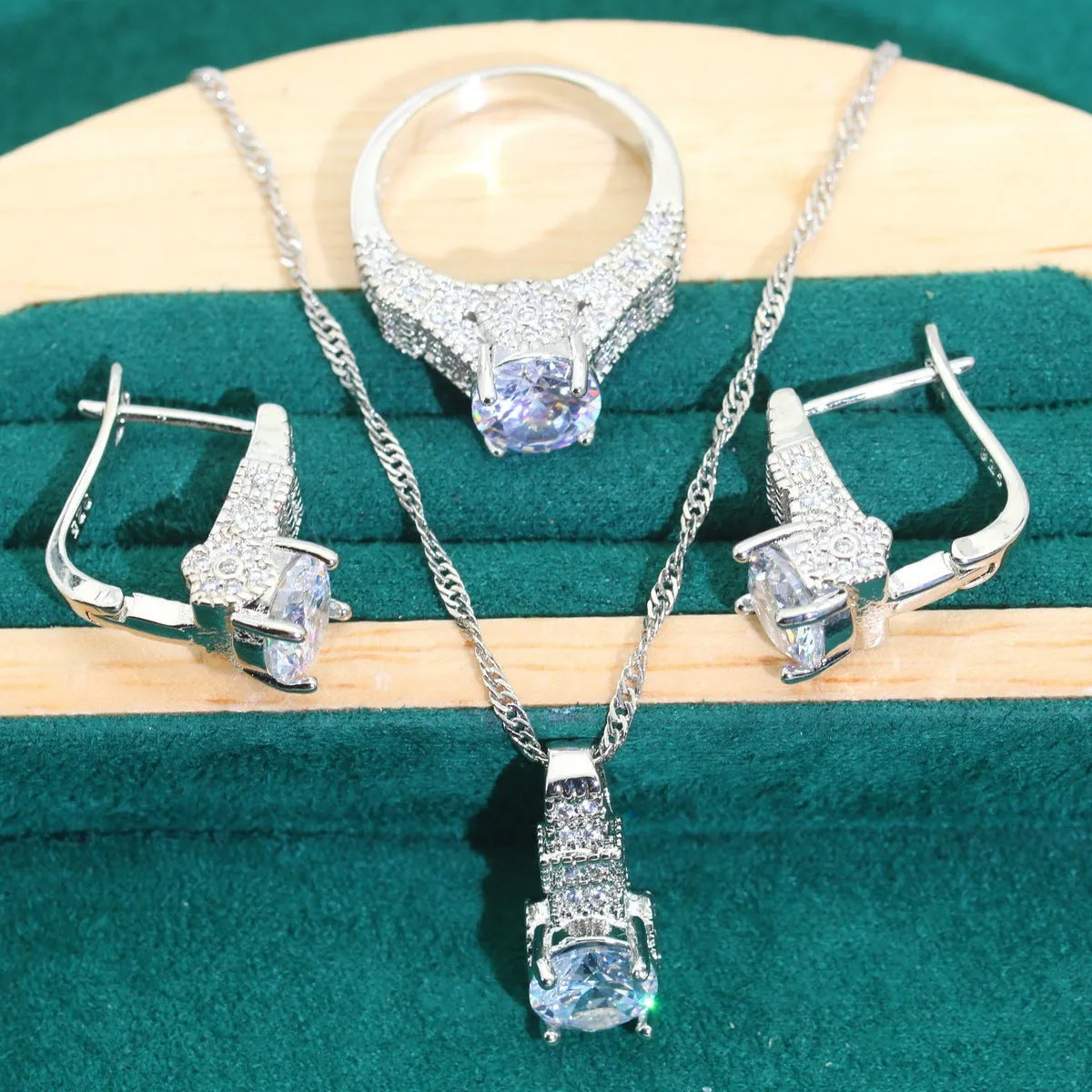 Four-piece bridal jewellery set showing necklace, bracelet, earrings and ring with alloy zircon and water wave chain design