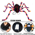 Orange Halloween spider backpack with purple LED lights on plush sugar bag material.