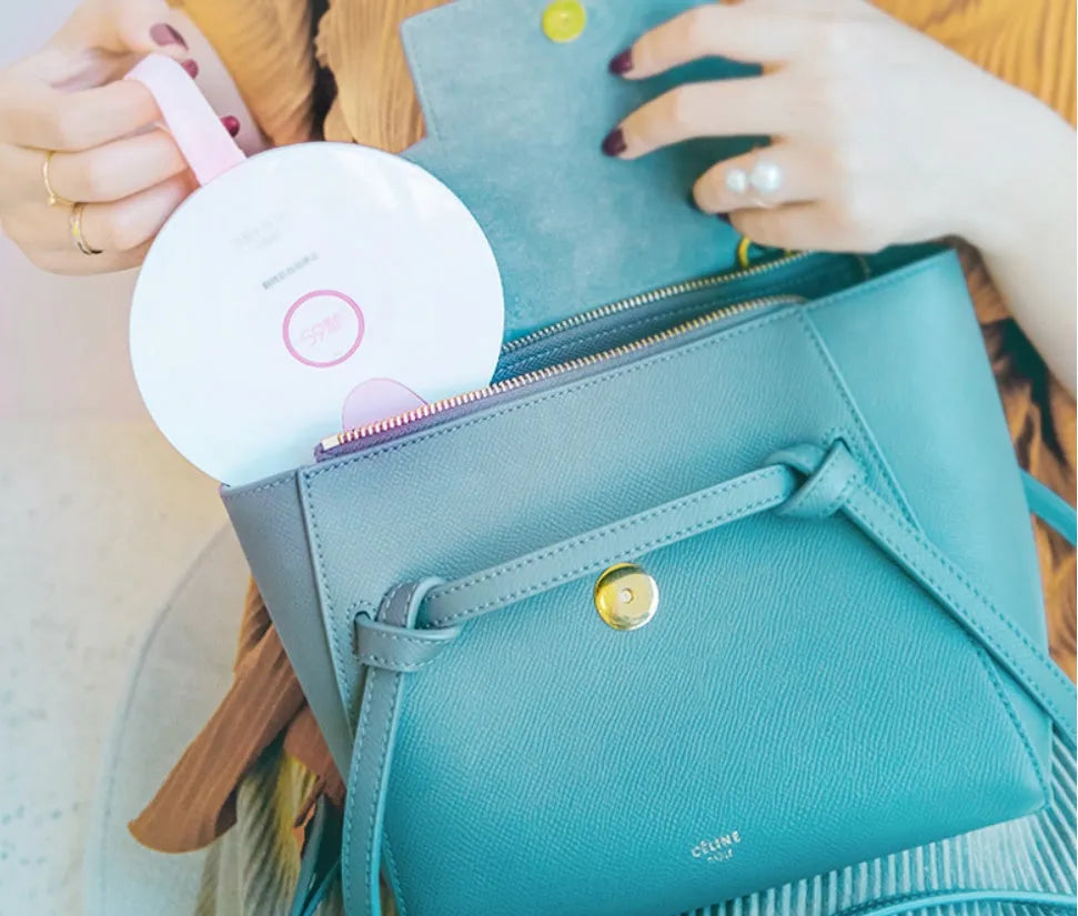 Compact blue or pink portable UV baby bottle sterilizer showing USB port and dimensions.