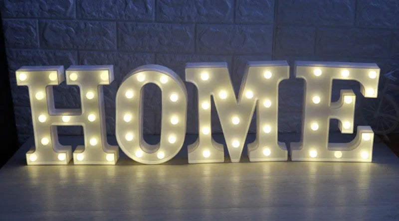 White plastic LED marquee letter sign with warm white glow, 22cm tall