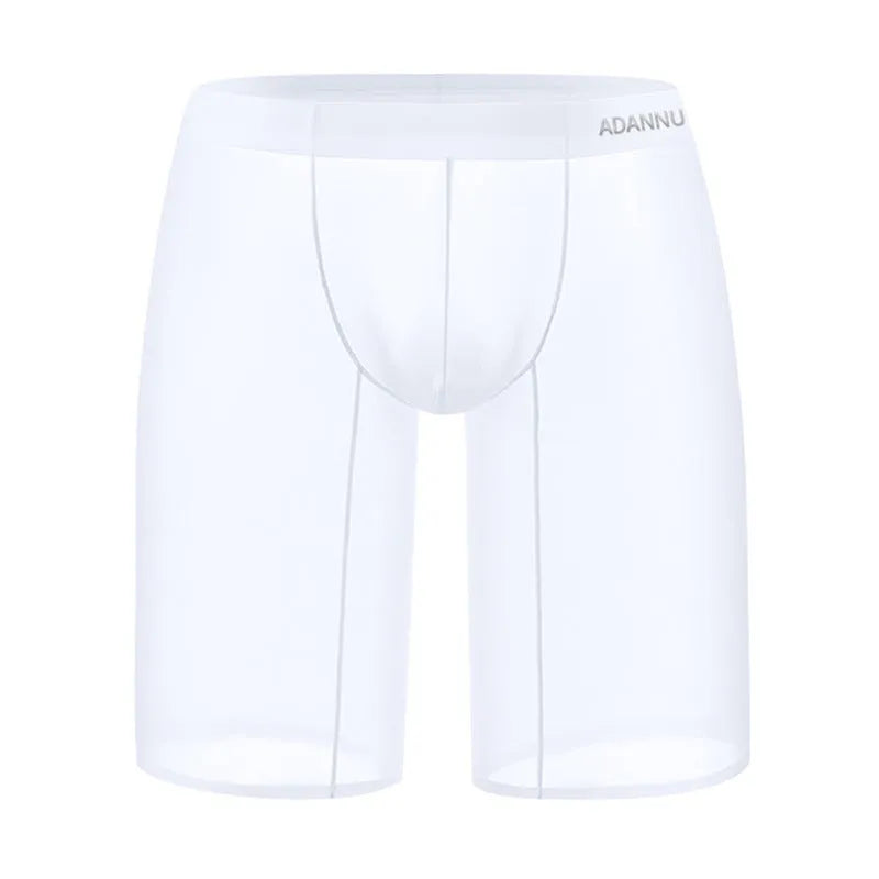 Man wearing black seamless nylon mesh home shorts with a hip-lifting design.