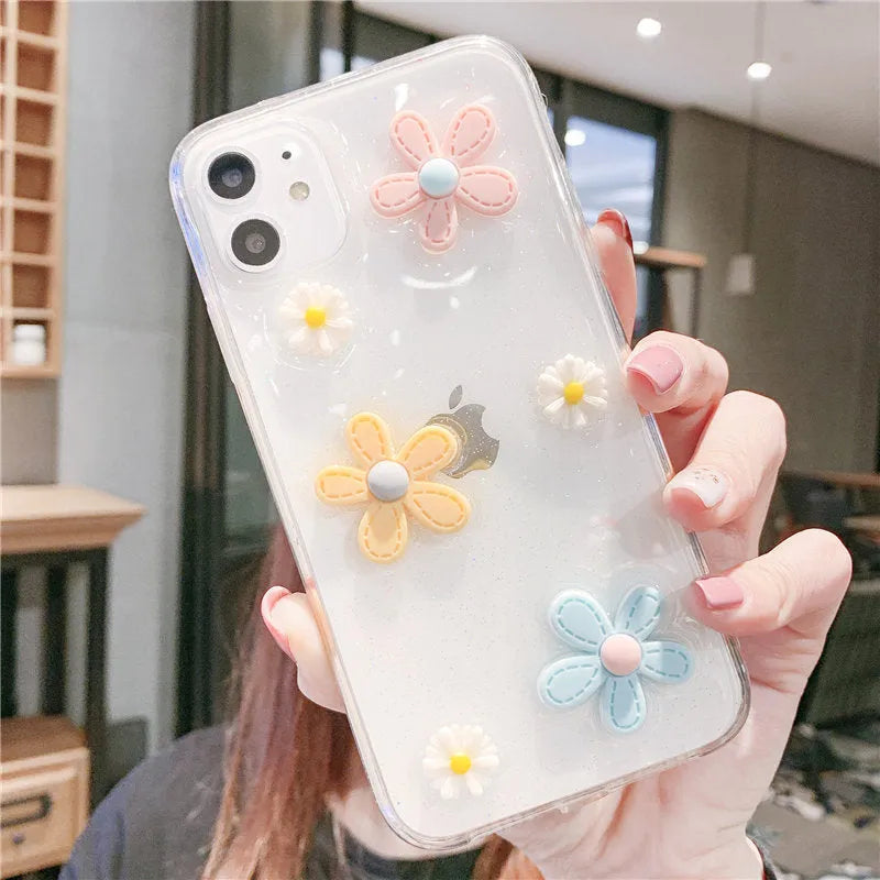 Soft rubber iPhone case with pink floral and girl heart pattern, shown fitted on a phone.