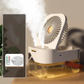 Pearl white desktop humidifier cooling fan with water tank, remote control, and night light on a wooden desk.