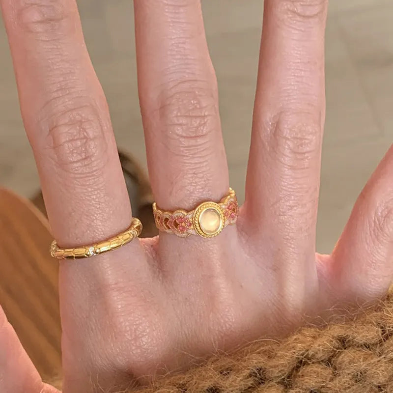 Women's geometric open ring with pink crystal enamel on gold-plated copper band