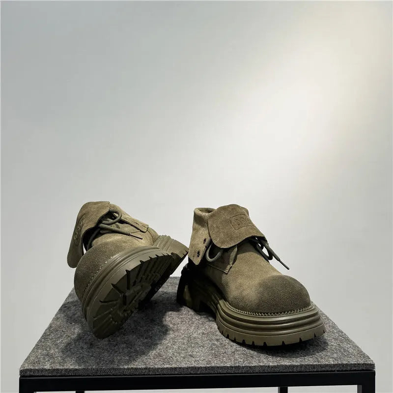 Men's distressed brown cow suede worker boots with thick soles and visible stitching.